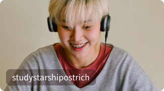 A student on a video call smiling