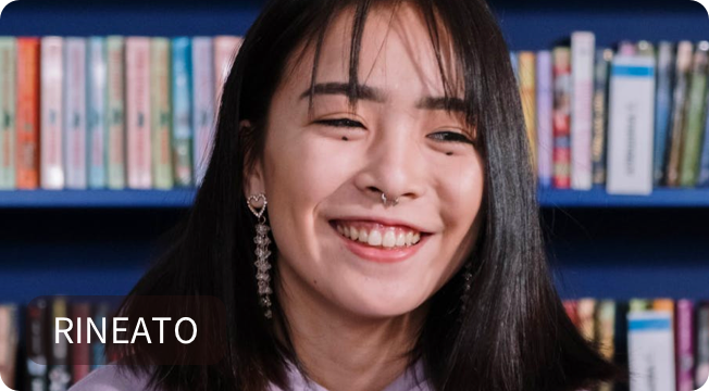 A female student on a video call smiling